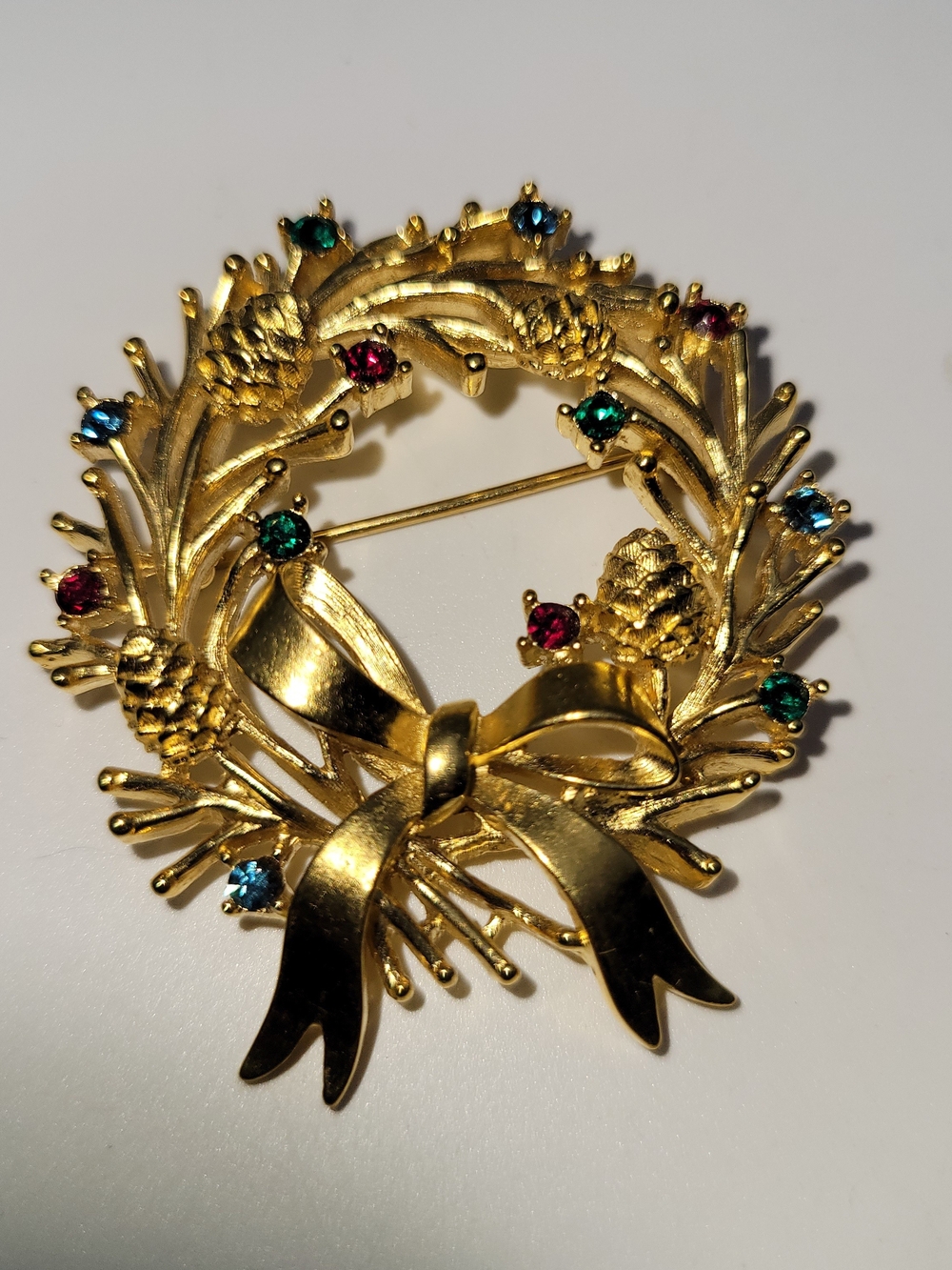 Vintage Trifari Gold Wreath Bow Brooch with Red & Green Rhinestones
